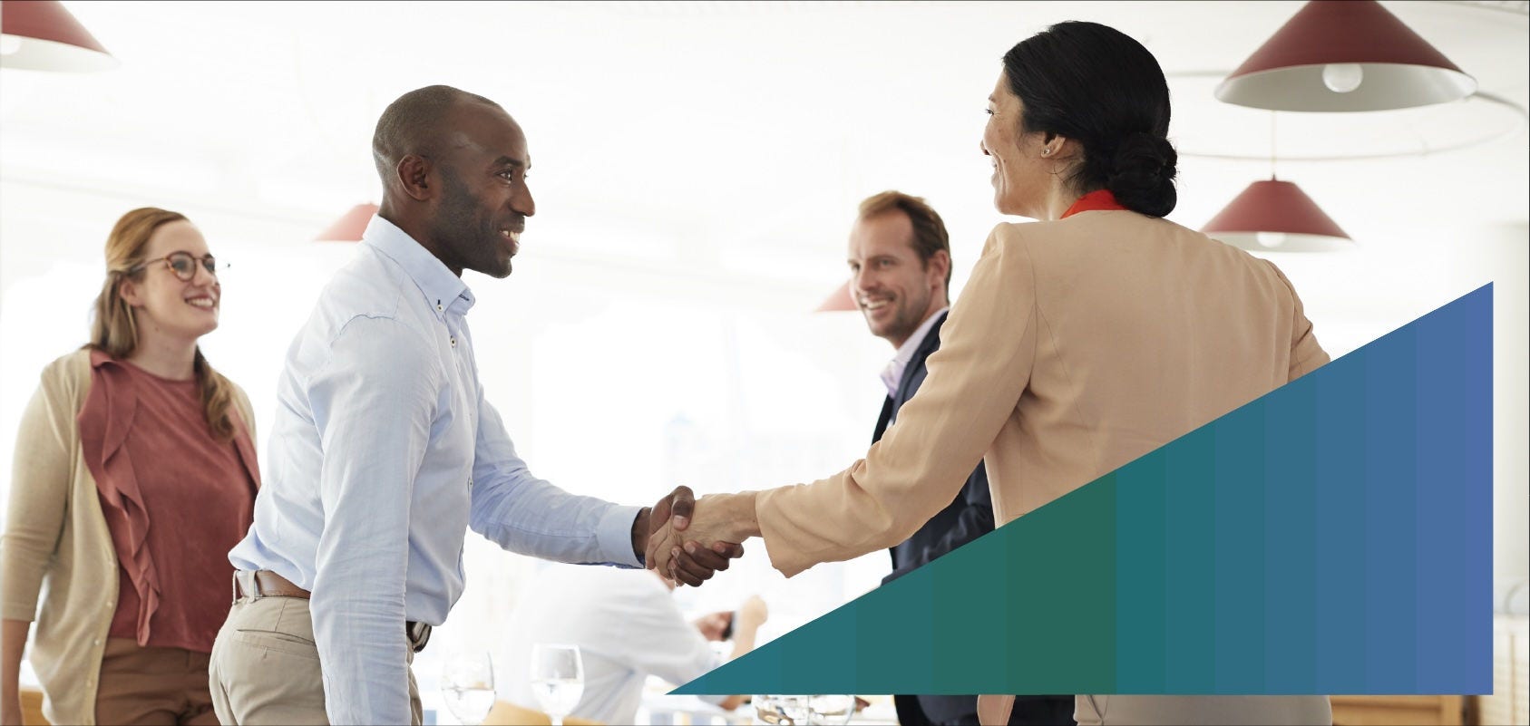 Businessman greeting potential clients at a restaurant 