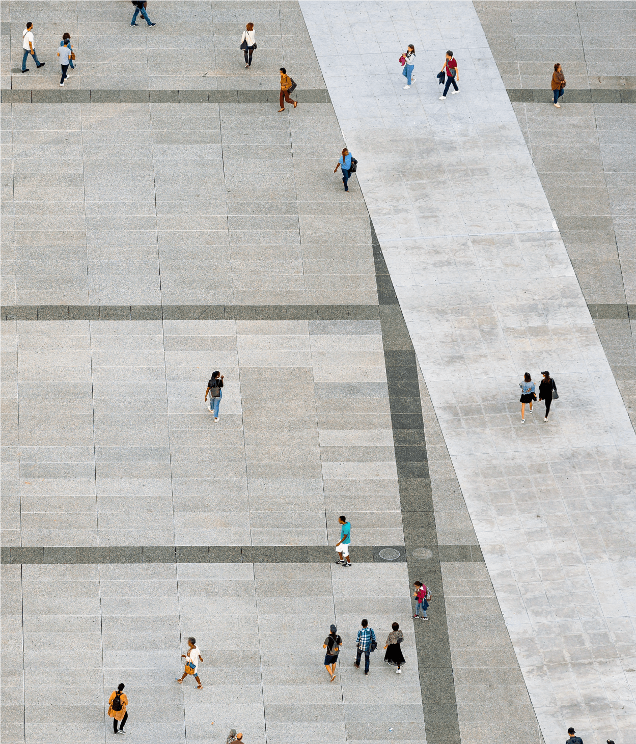 Aerial view of people walking across courtyard