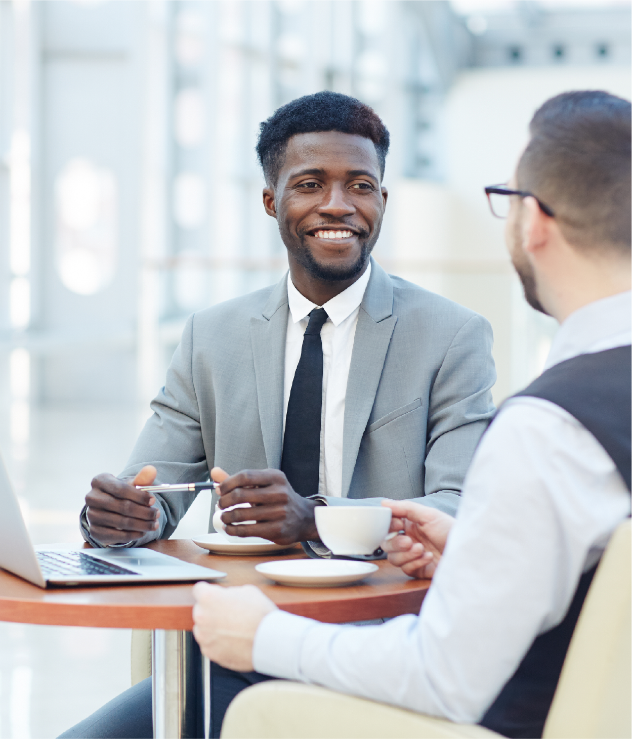 Young businessman meeting a prospective client at lunch.