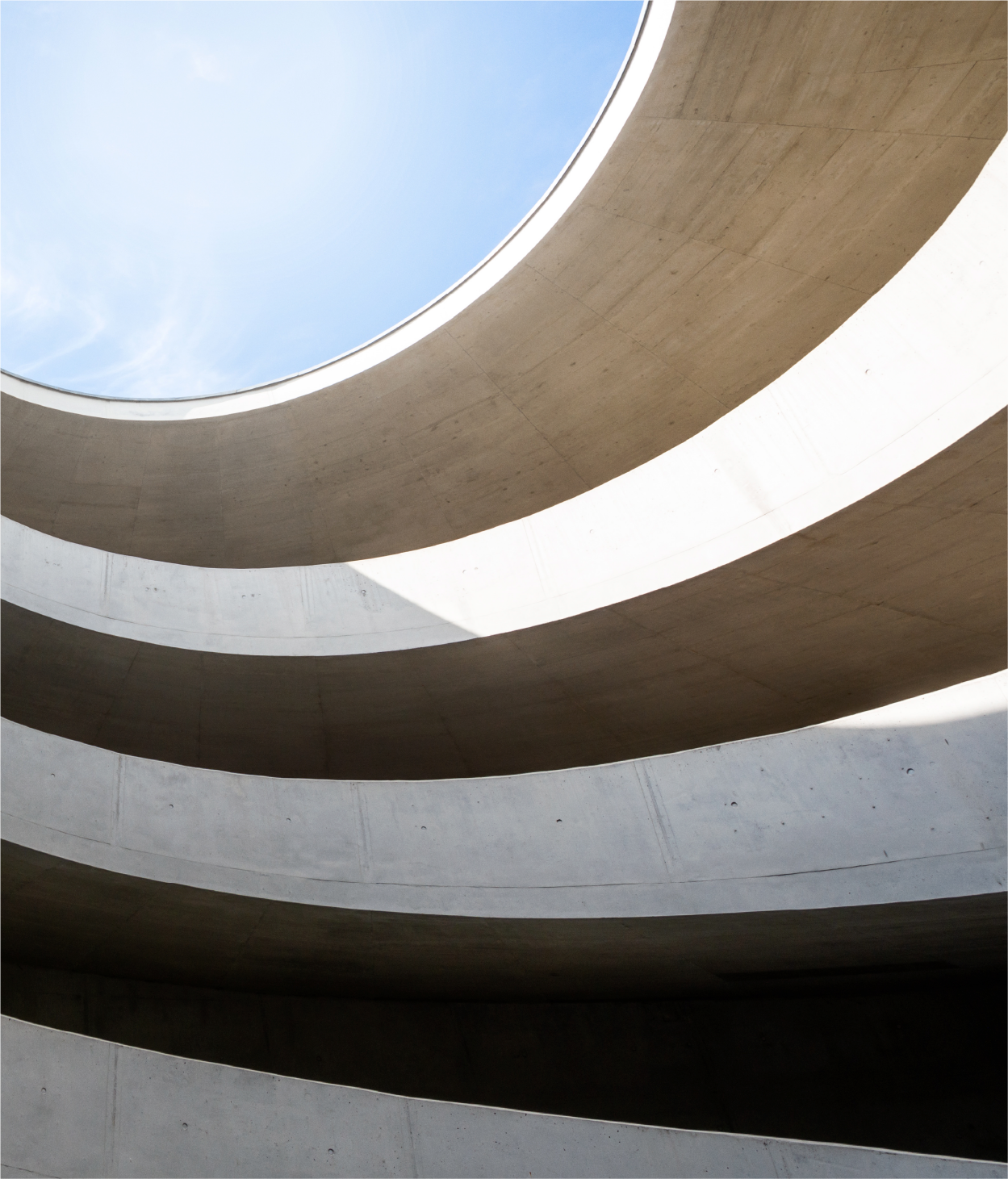 Abstract image of curved parking garage ramps