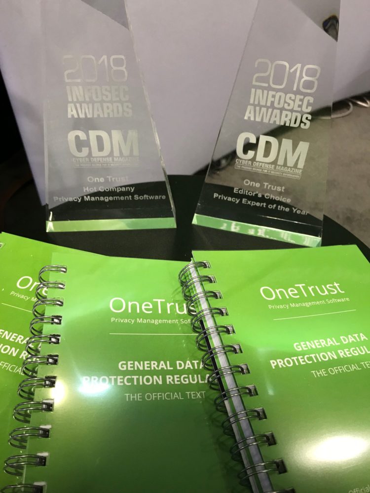 Photo of Onetrust's 2018 inforsec award trophies and Onetrust GDPR regulation books