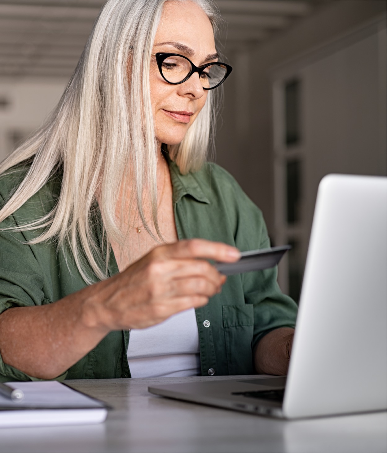 Woman shopping online with her credit card.