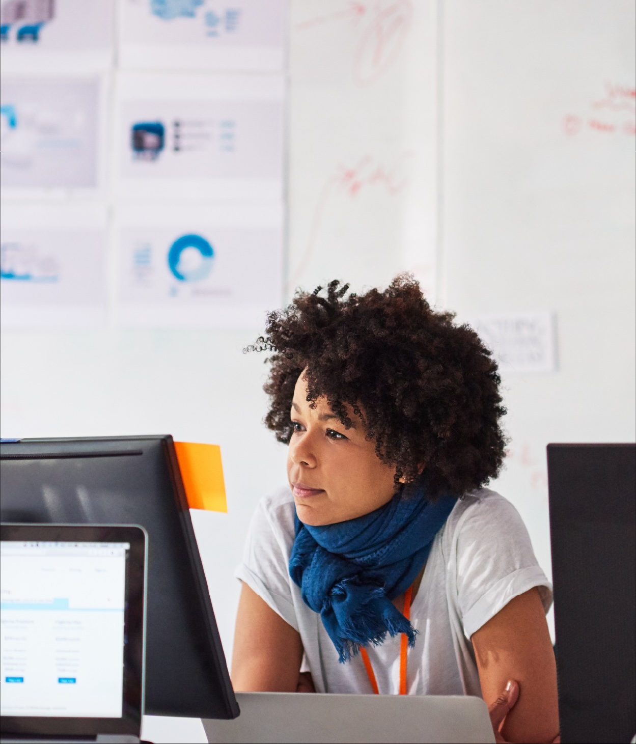 Woman looks at her computer monitor in an office..