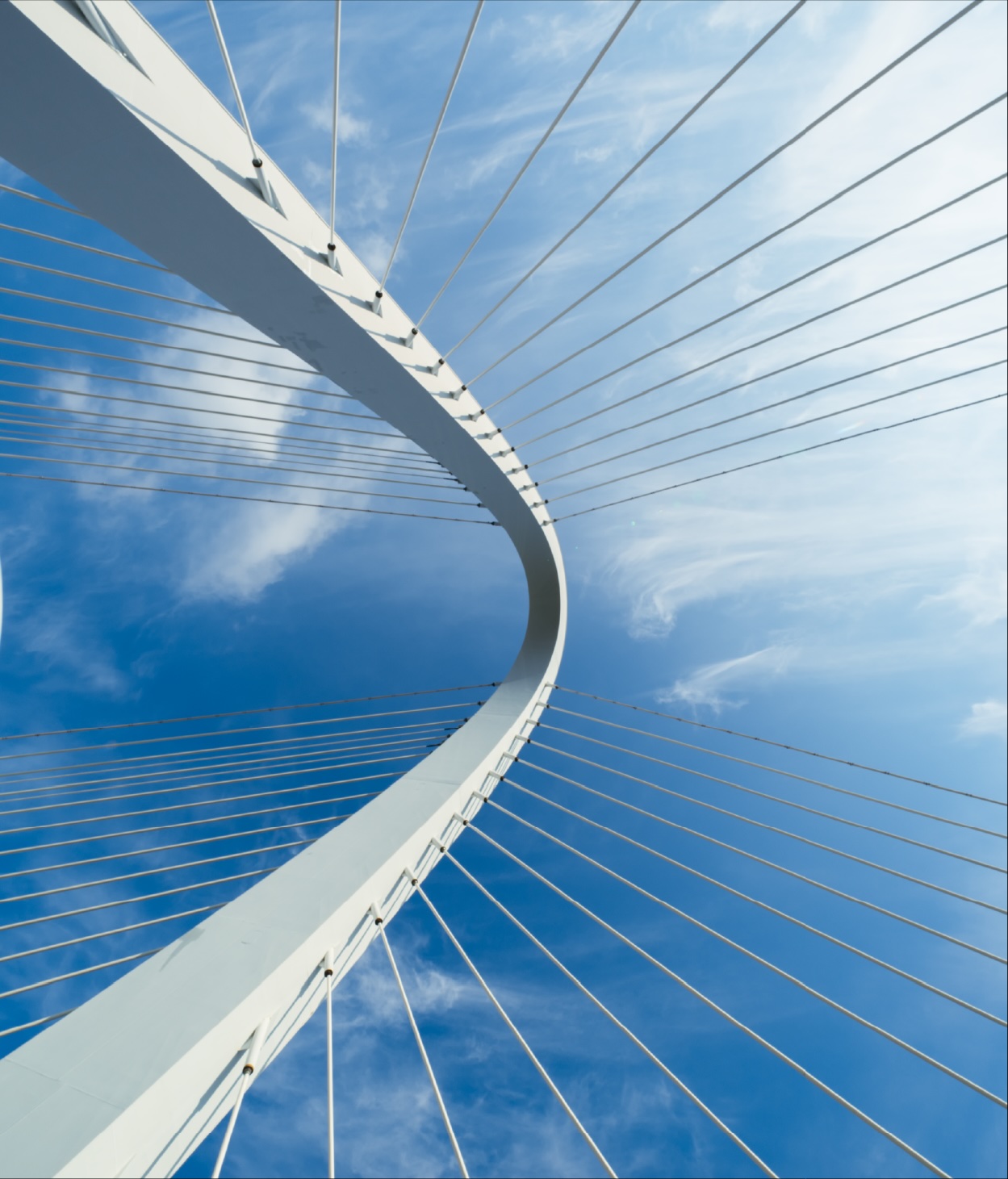 Looking up at a bridge's arch support