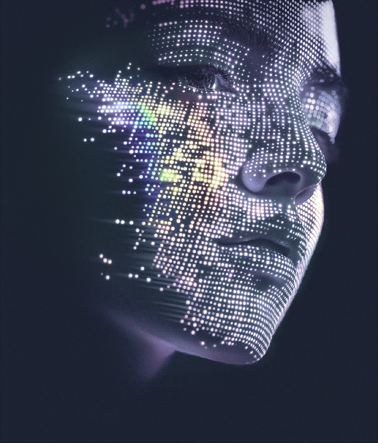 Closeup of a woman's face lit up with LCD lights