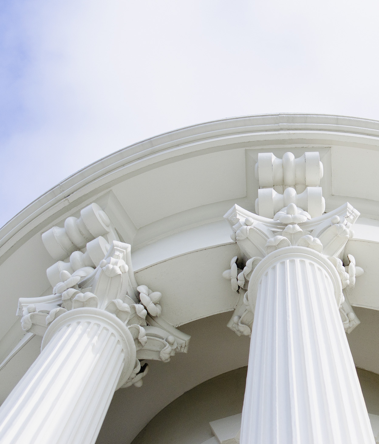 US Capitol building in Washington DC at a low angle with a view of the columns