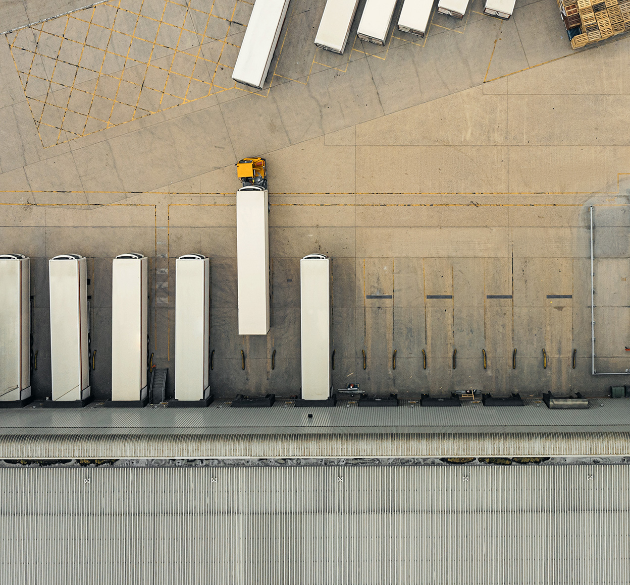 Aerial photo of trucks outside of a warehouse