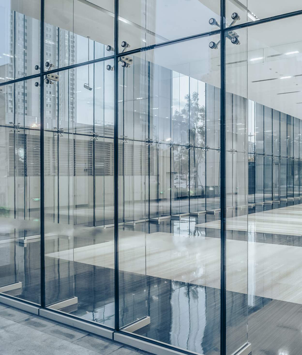 Shot in Lujiazui, Tianjin, view of city skyline through large office building windows