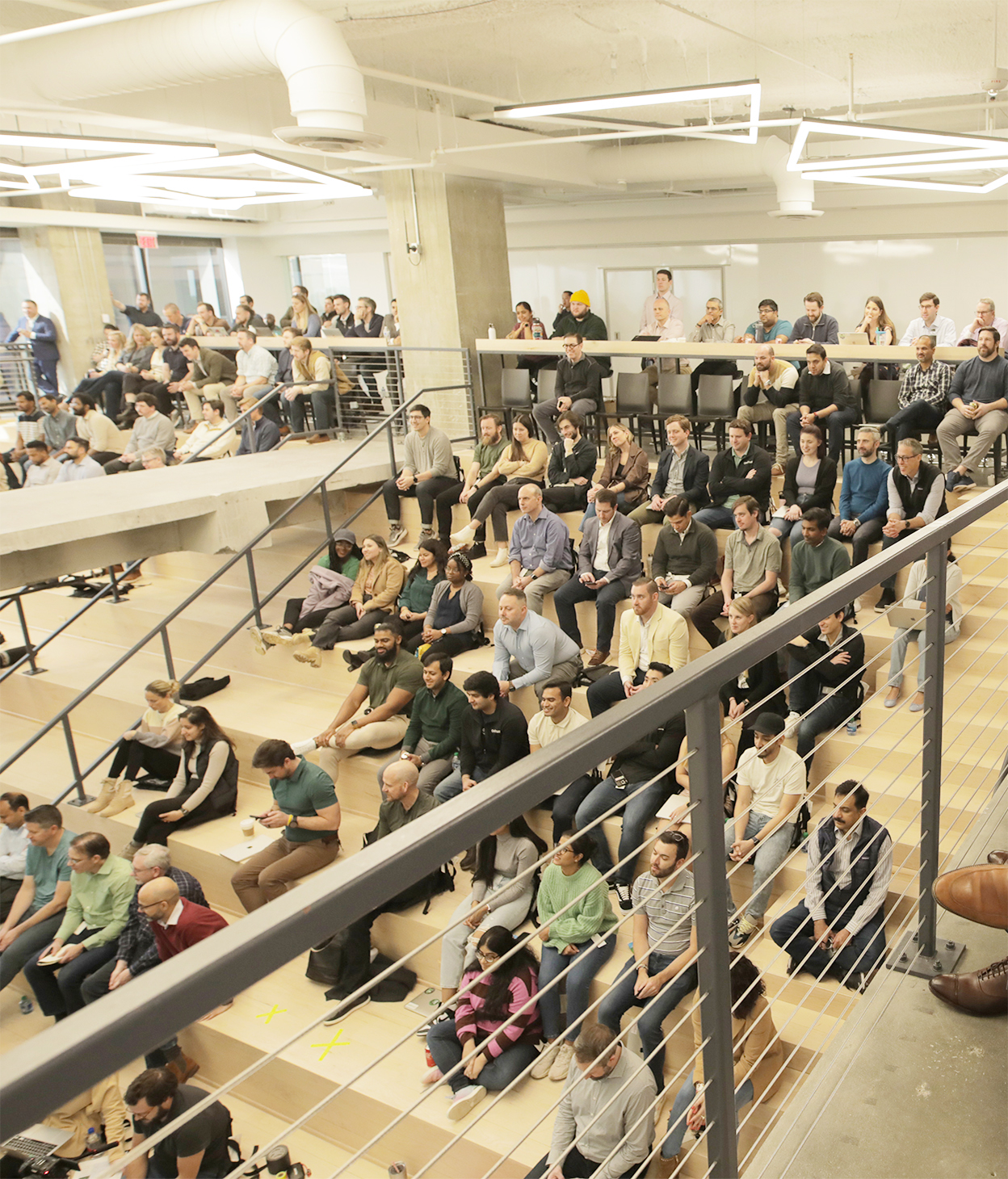 Employees gathered in an office auditorium