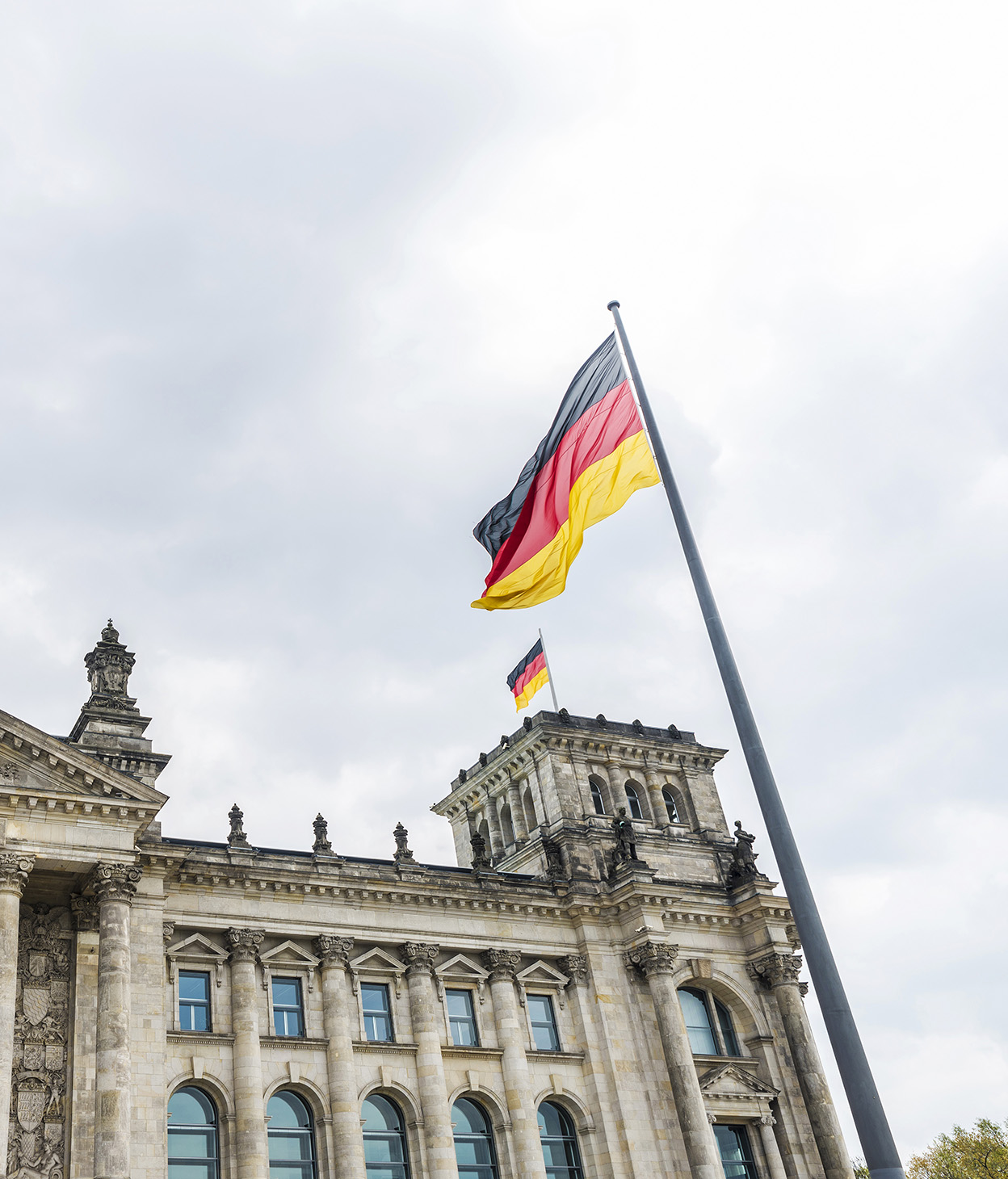German flag in front of a government building.