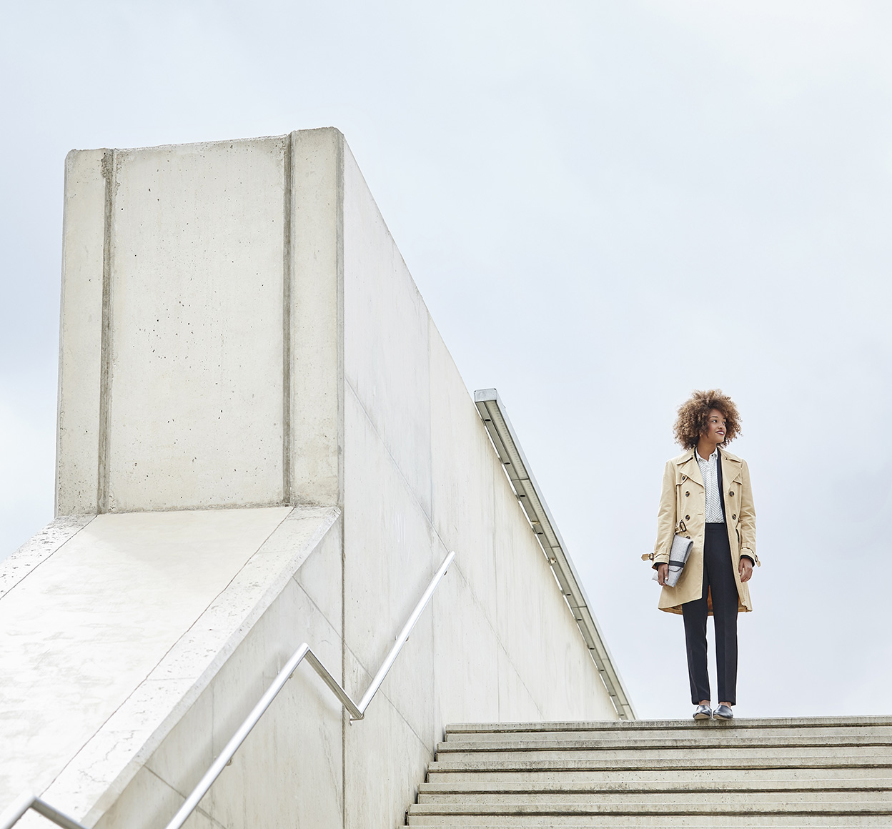 Low angle view of businesswoman standing on steps