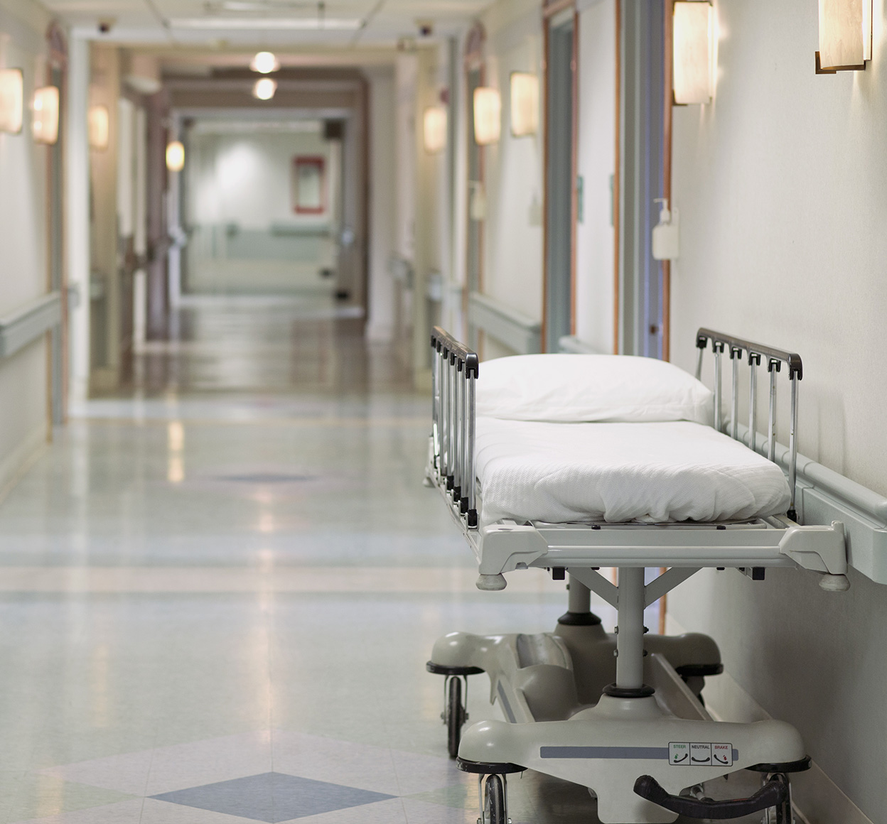 Patient bed in a hospital hallway