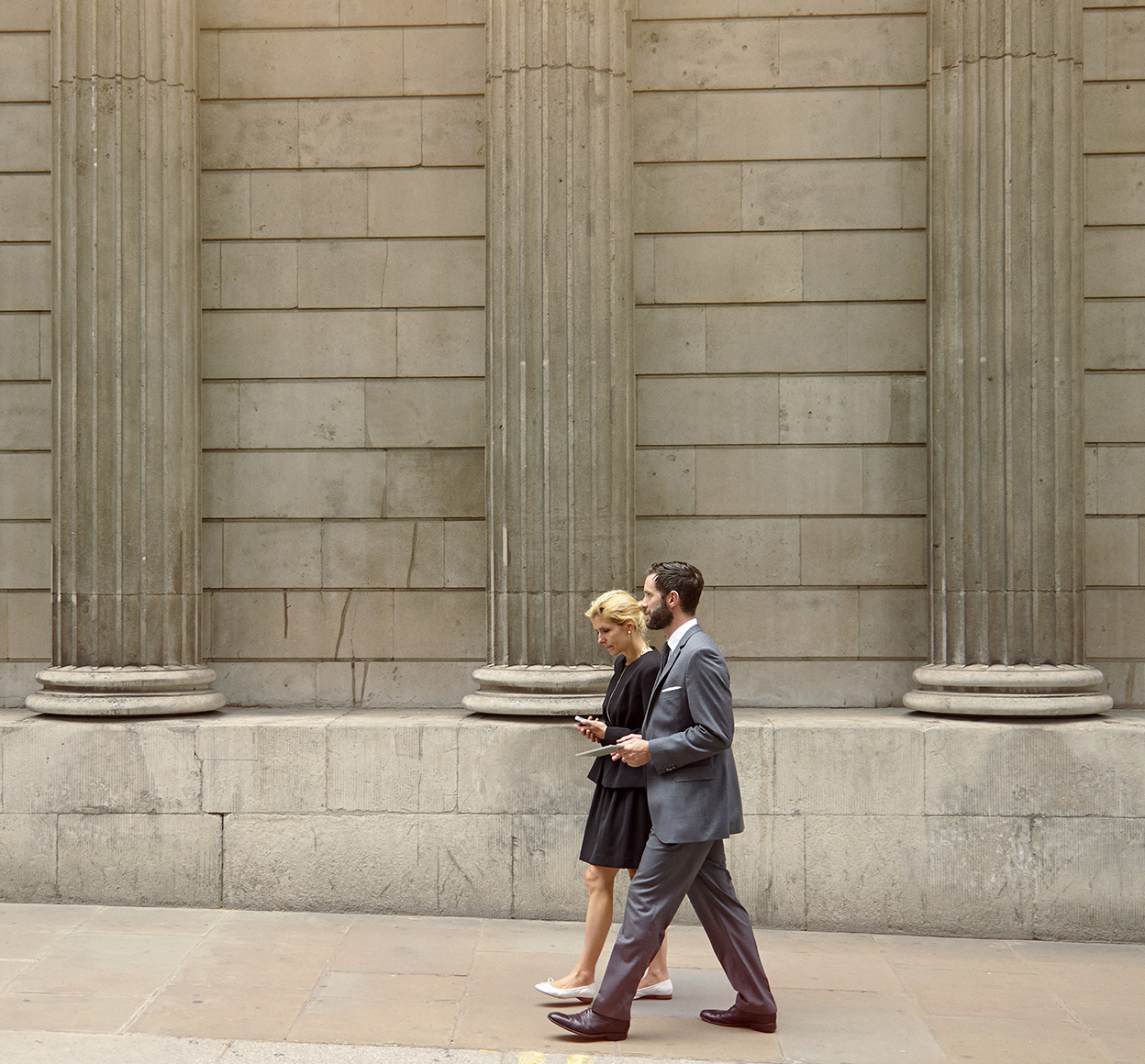 two professionals walking outdoors