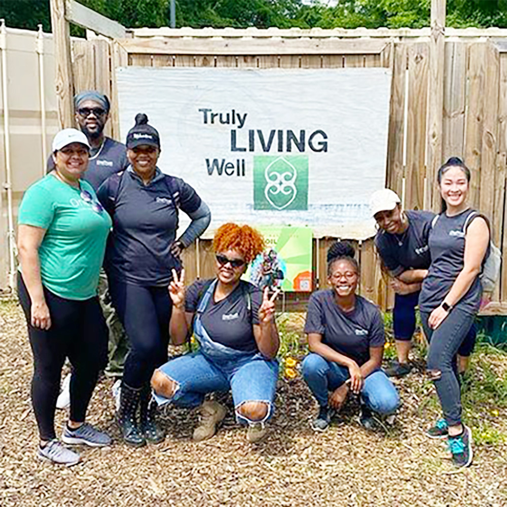 Team members pose for a photo while working on a community climate project