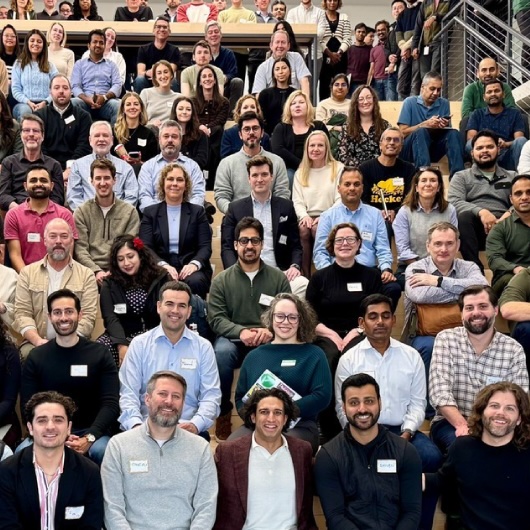 OneTrust CEO Kabir Barday and employees pose for a photo at OneTrust headquarters in Atlanta