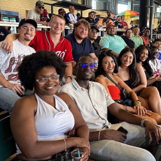 OneTrust employees enjoying a OneClub event at a baseball stadium