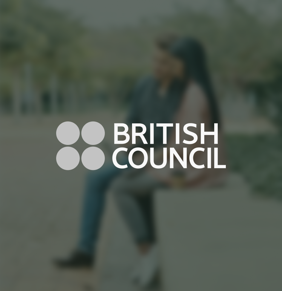 British Council logo on top of blurred image of man and woman in a park