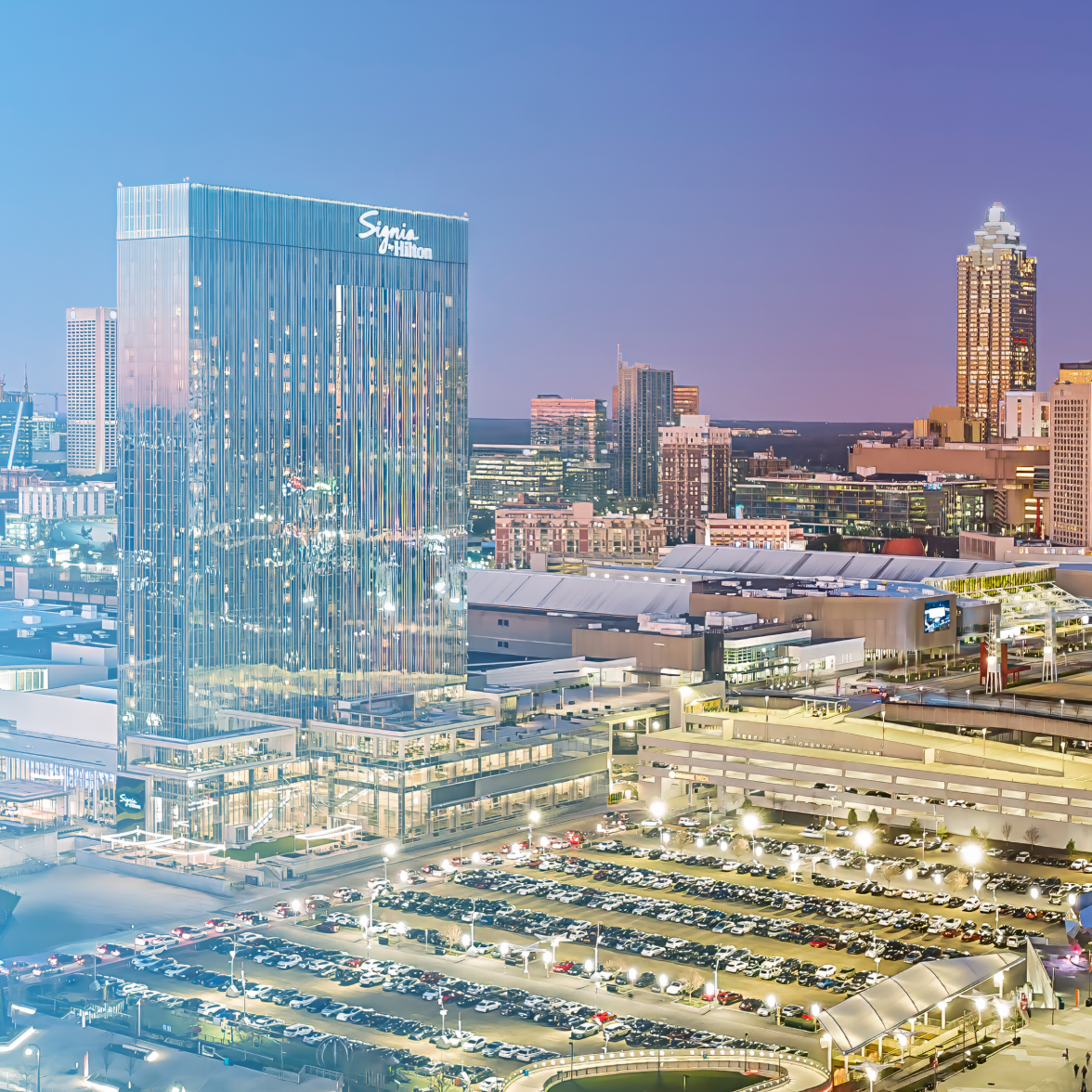 Photo of the Atlanta skyline with a light blue gradient overlay