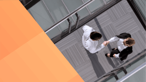 OneTrust thumbnail of an aerial view of two businesspeople sharing a handshake on a walkway over a staircase