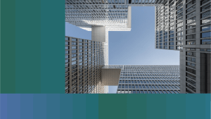 OneTrust thumbnail of skyscrapers connected by skywalks. The viewer is looking up at the skyscrapers from ground level so that the blue sky can be seen between them with green and blue step gradient.
